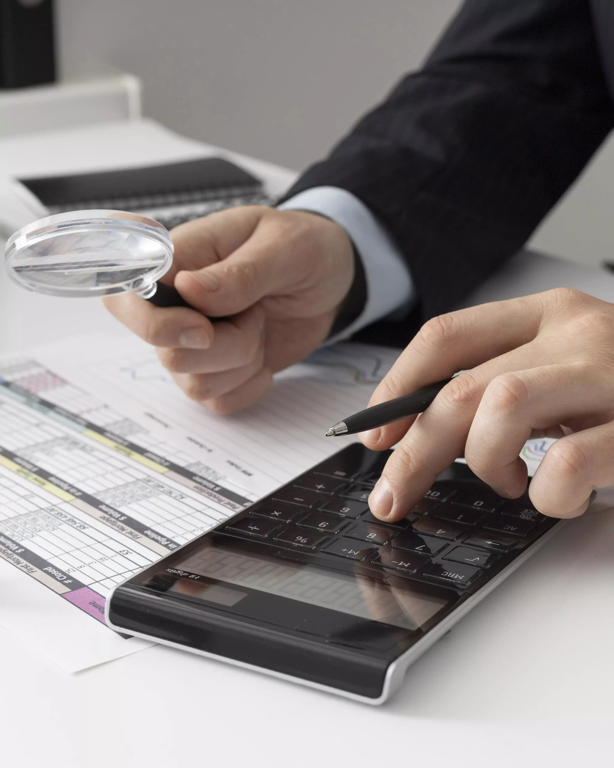 AnyConv.com__business-man-calculating-finance-numbers (1)